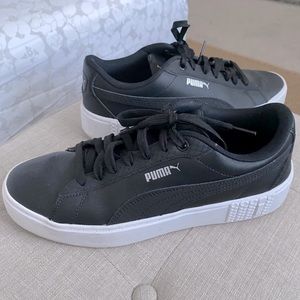 Black platform Puma sneakers